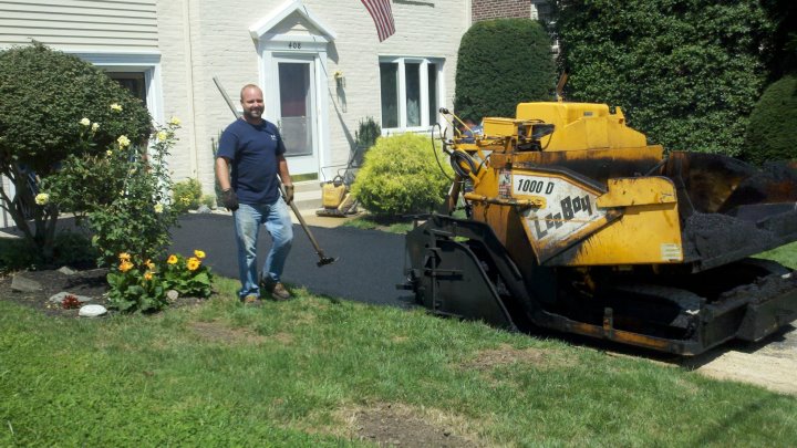 picture of Mr. Kane building a new asphalt driveway